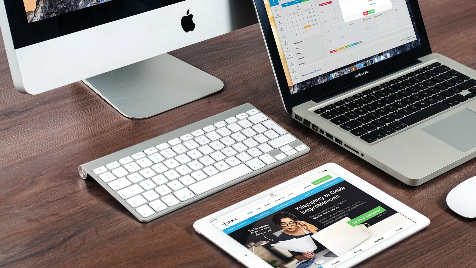 Paperless work desk with Apple devices representing shared Claude transcripts becoming public artifacts