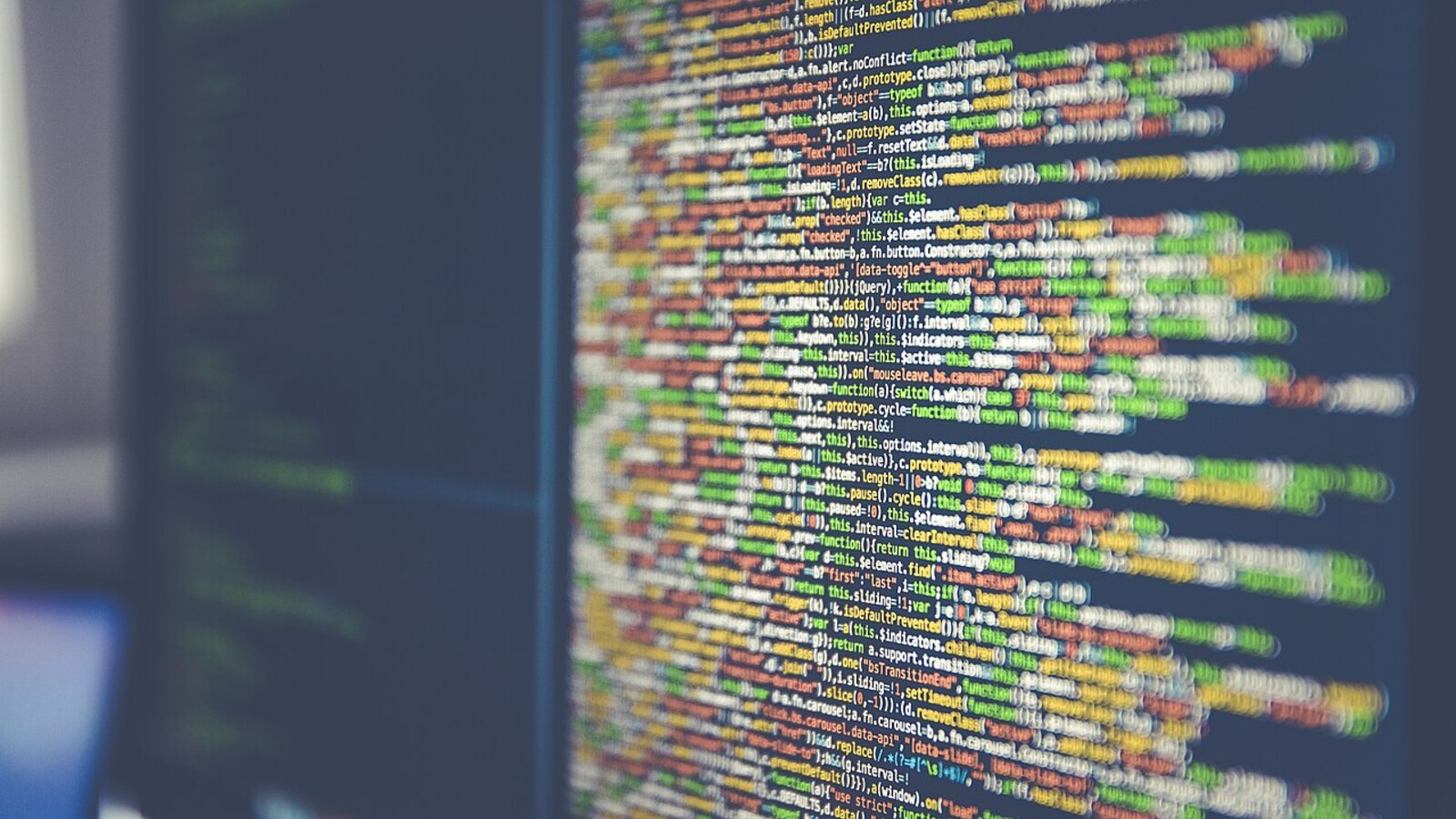 Close-up of colorful code on a computer monitor